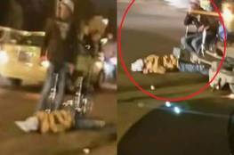 شاهد: أردني يقتل شقيقته في الشّارع و يضع كرسياً ويجلس عليه بجانب الجثة!!